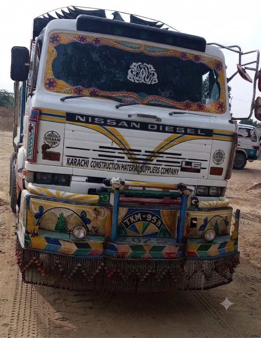 The company dumper truck, painted with Pakistani truck art and lettered with the company name